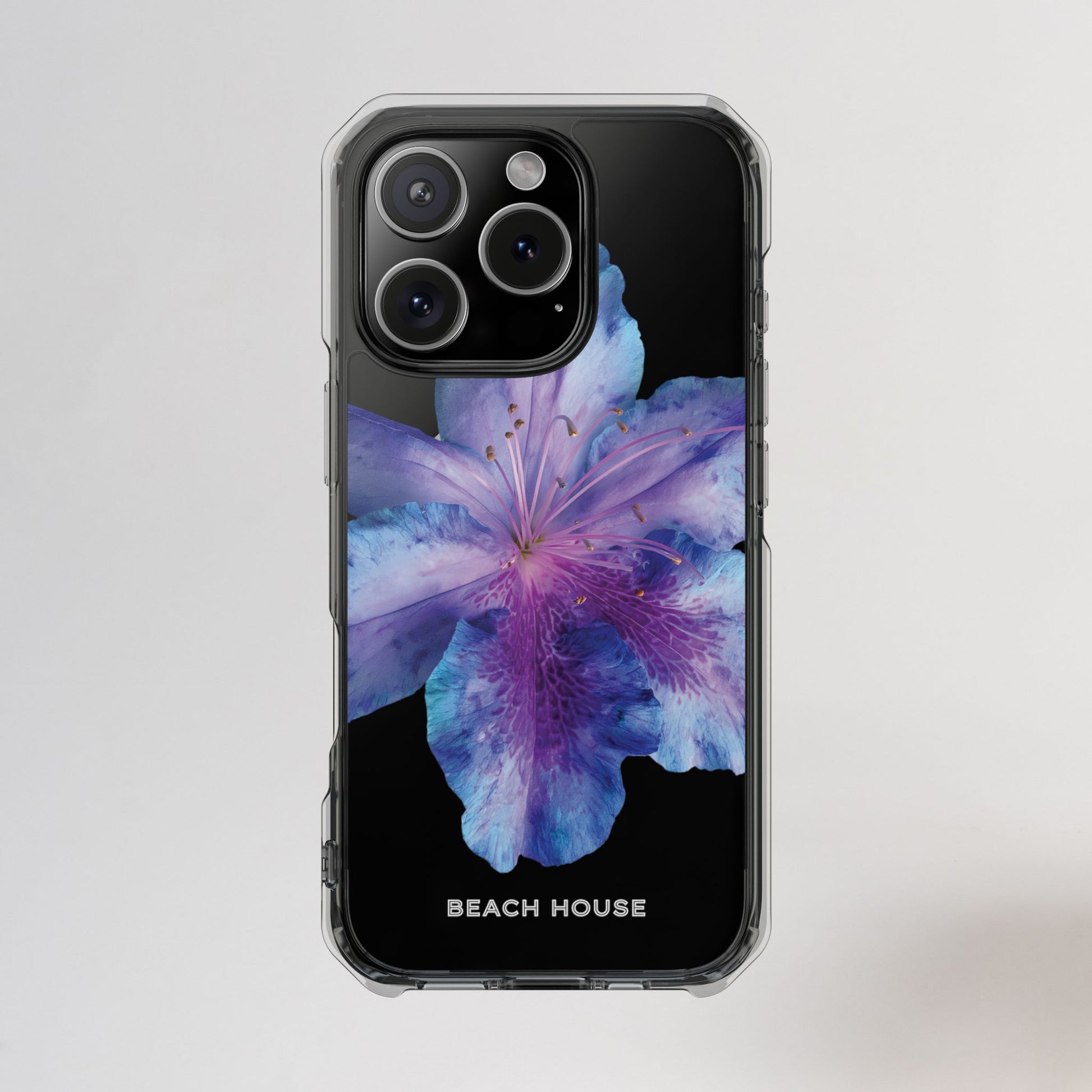 Phone case with a purple flower design on a light gray background