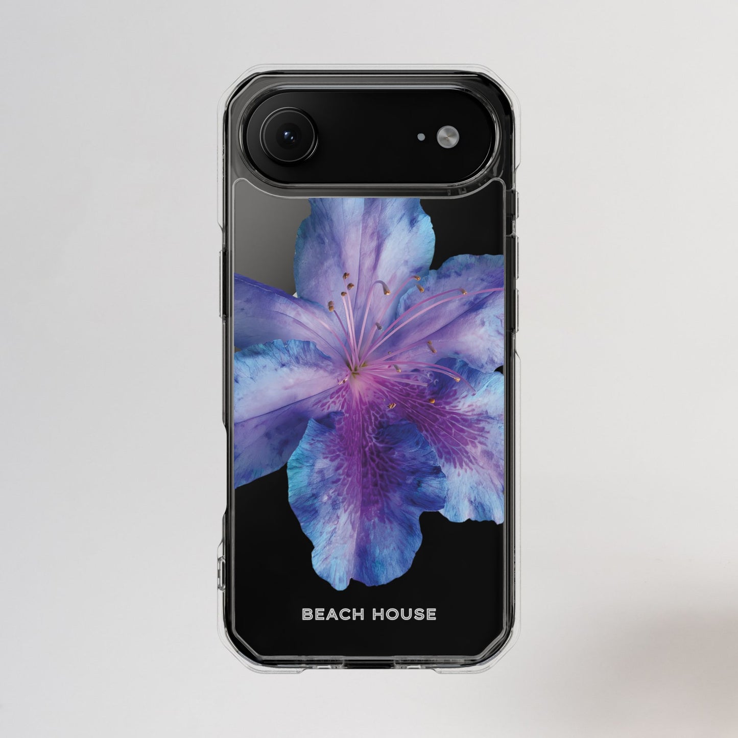 Phone case with a purple flower design on a light gray background