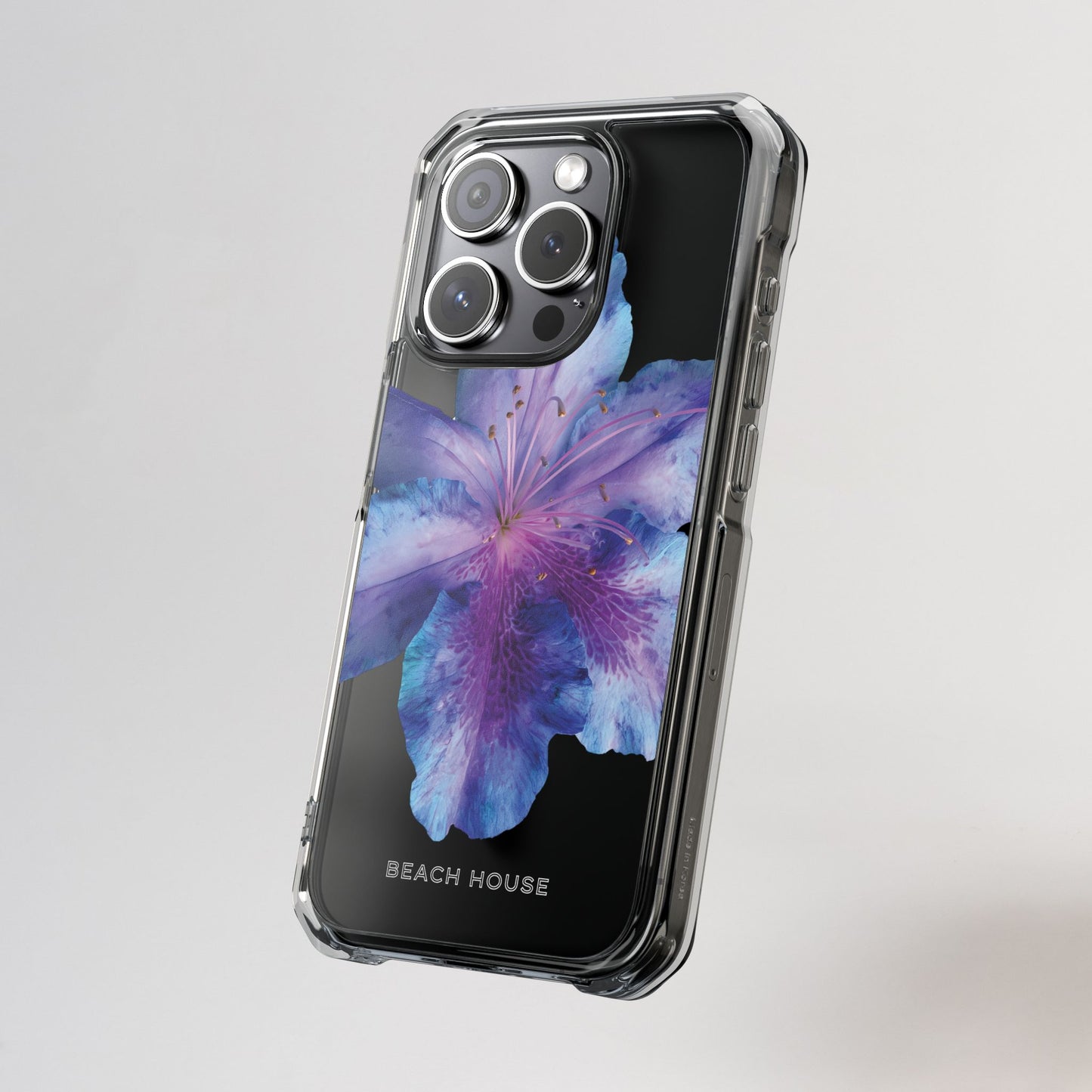 Phone case with a colorful flower design on a gray background