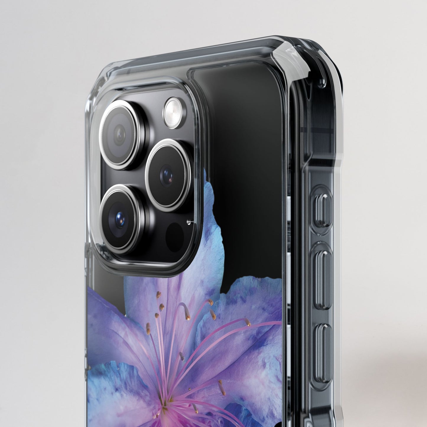 Phone case with floral design and camera details on a light gray background