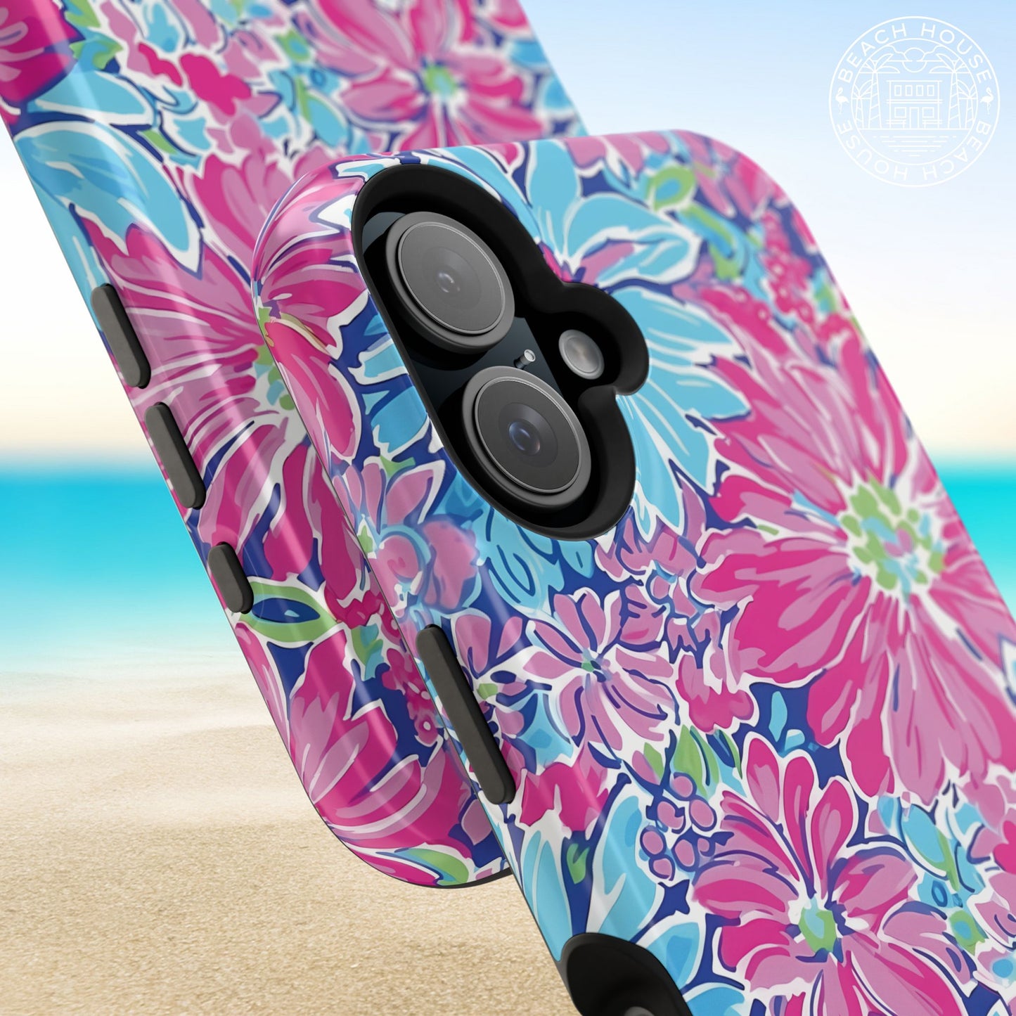 Close up views of the Bimini MagSafe Tough Case for iPhone with pink and blue flowers on a beach background