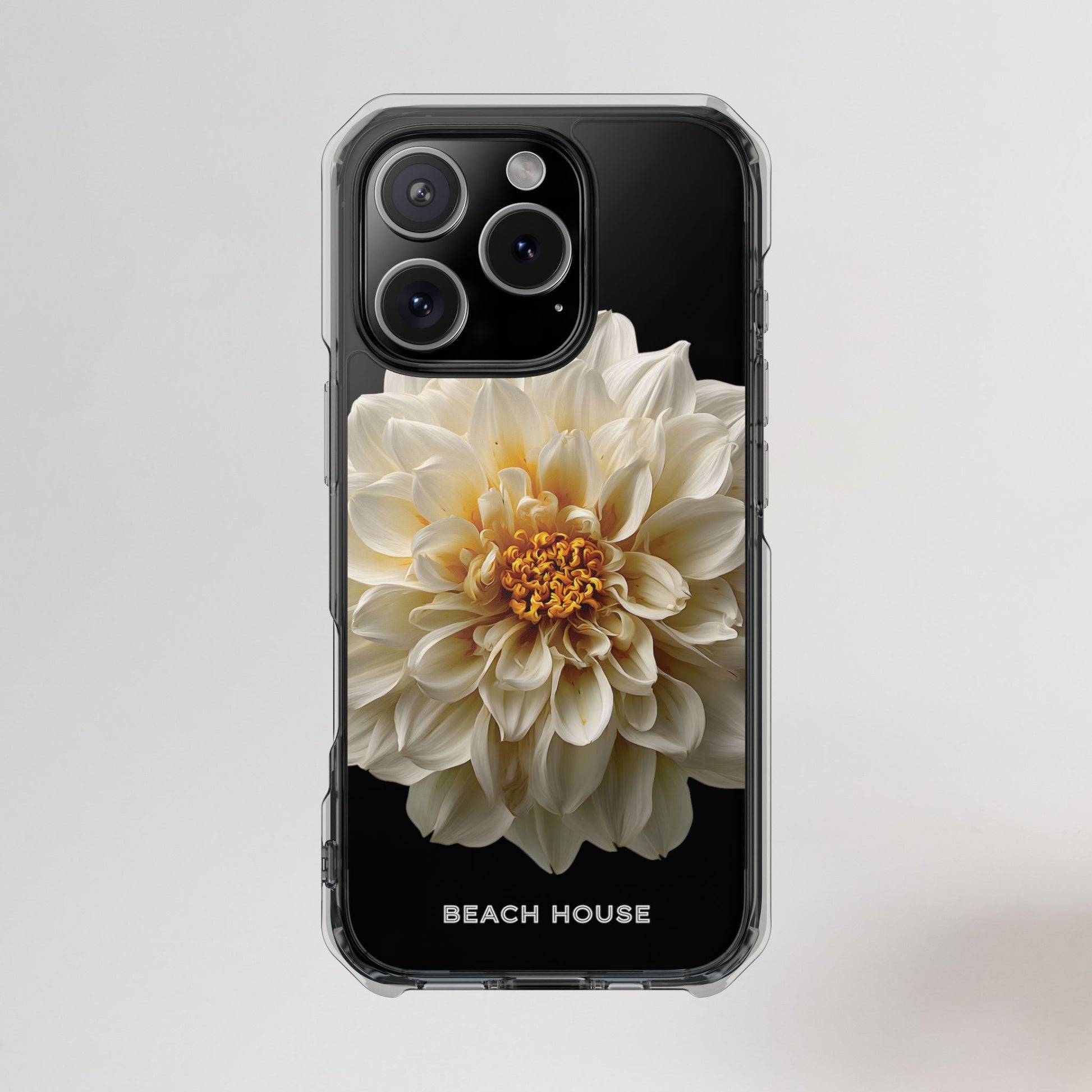 Phone case with a large white flower design and 'Beach House' text on a light gray background
