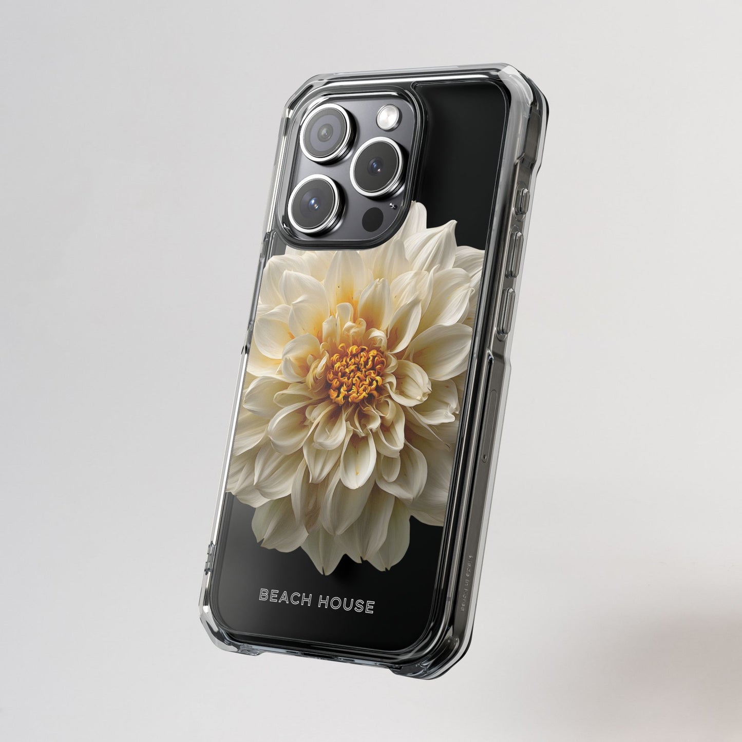 Phone case with a white flower design on a gray background