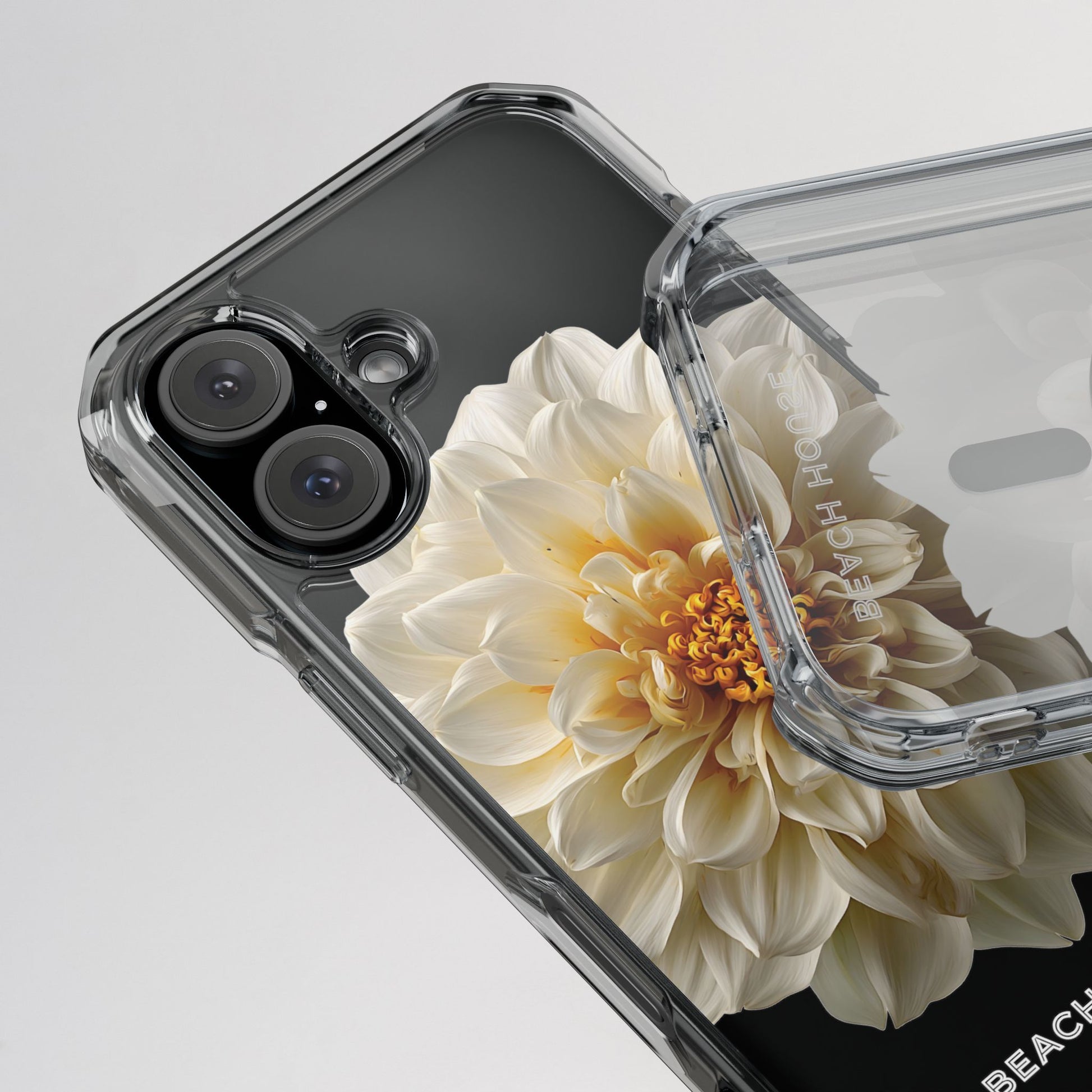 Phone case with a white flower design on a gray background