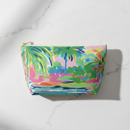Colorful pouch with a tropical design on a marble surface