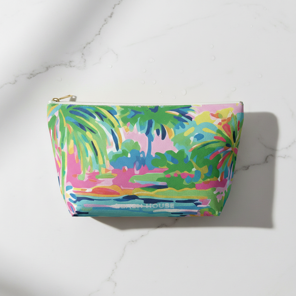 Colorful pouch with a tropical design on a marble surface