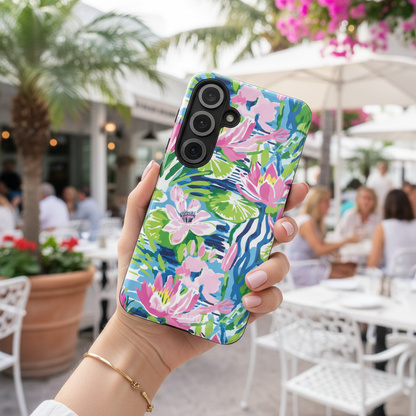 Womans Hand holding a Everglades Tough Case for Galaxy with a colorful floral case in an outdoor setting