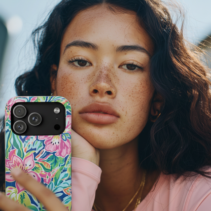 Woman holding a Fernandina Tough Case for iPhone with a tropical design 