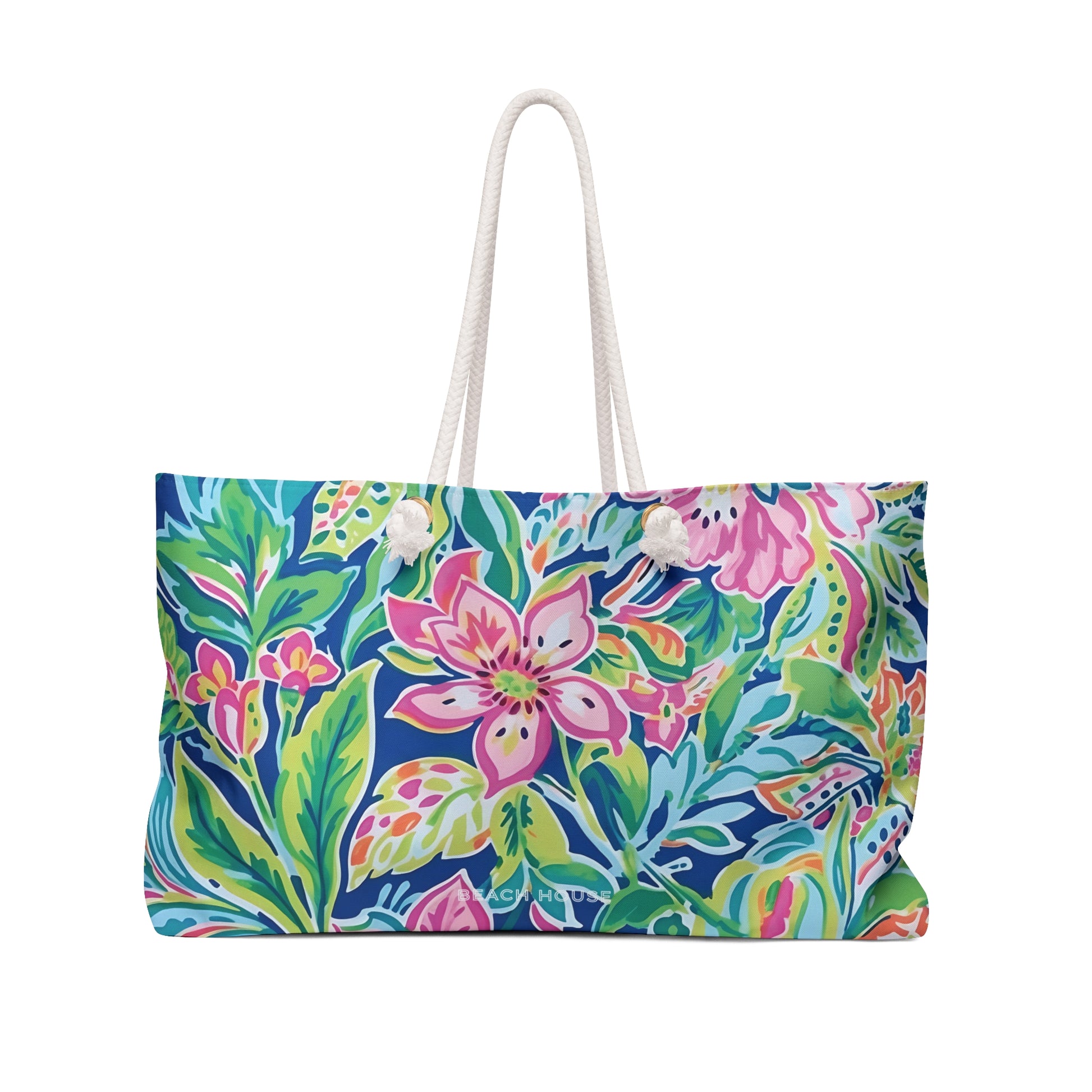 Front view of lightweight Fernandina Weekender vacation bag with a white handle on a white background