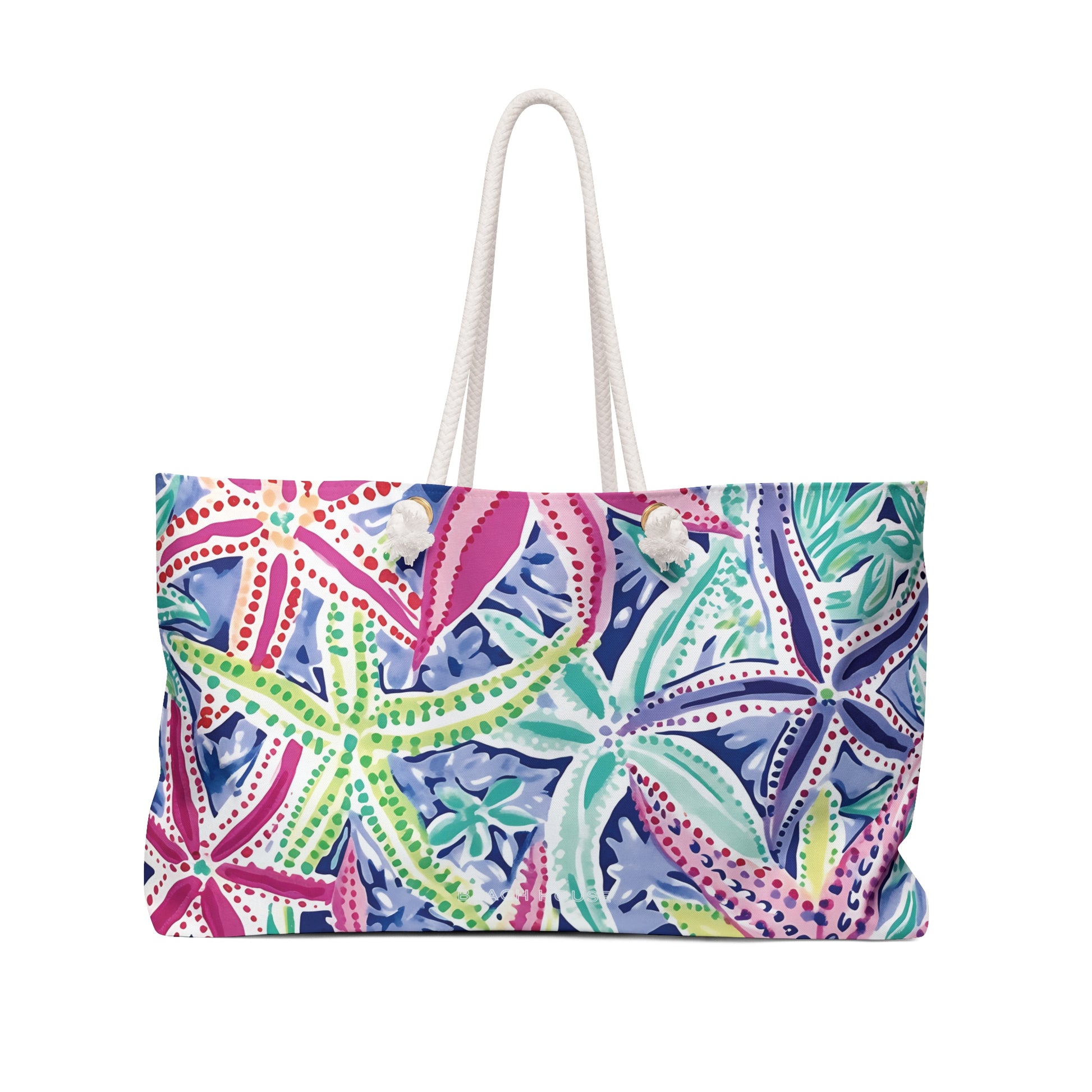 Front view of a Starfish and floral patterned Siesta Key Weekender Tote Bag with a white handle on a white background