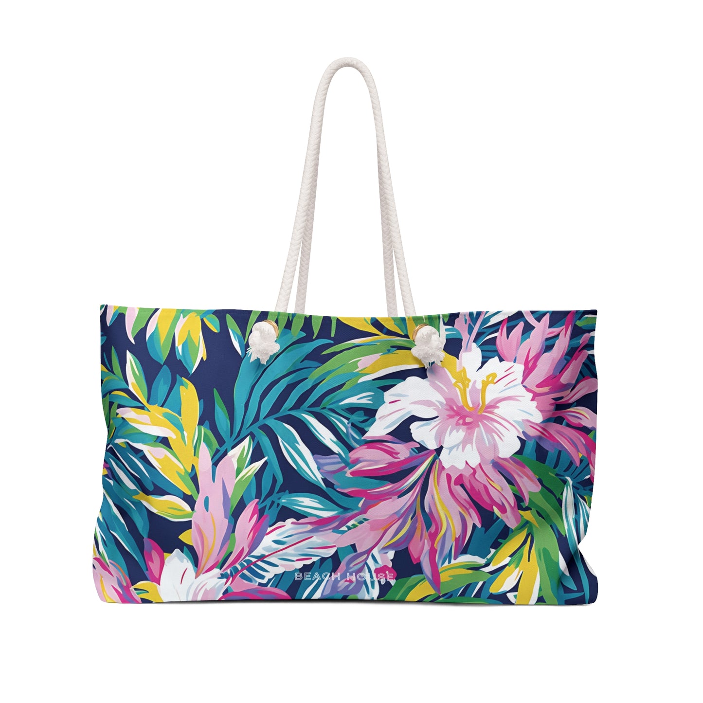 Front view of Tropical floral patterned Playa Hermosa Weekender Tote Bag with a white rope handle on a white background