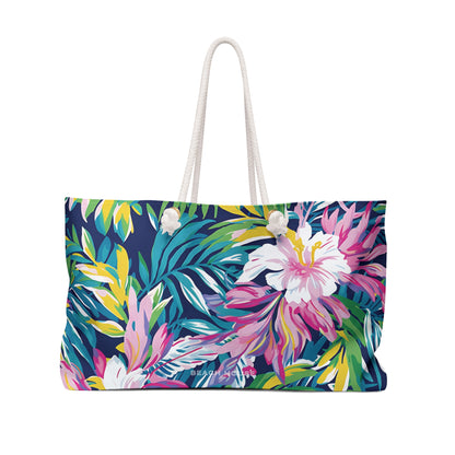 Front view of Tropical floral patterned Playa Hermosa Weekender Tote Bag with a white rope handle on a white background