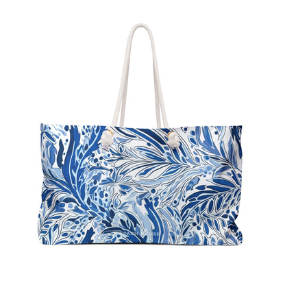Nags Head Weekender Tote bag with blue and white leaf pattern on a white background. Tropical pattern.