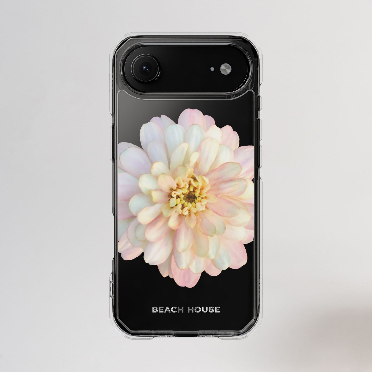 Phone case with a pastel flower design and 'Beach House' text on a light gray background