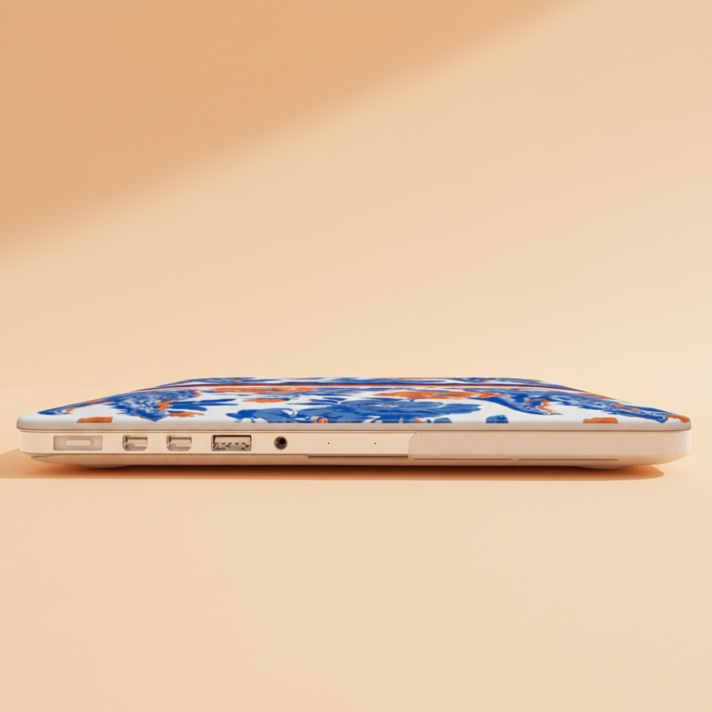Laptop with a floral Gainesville MacBook Case on a beige background