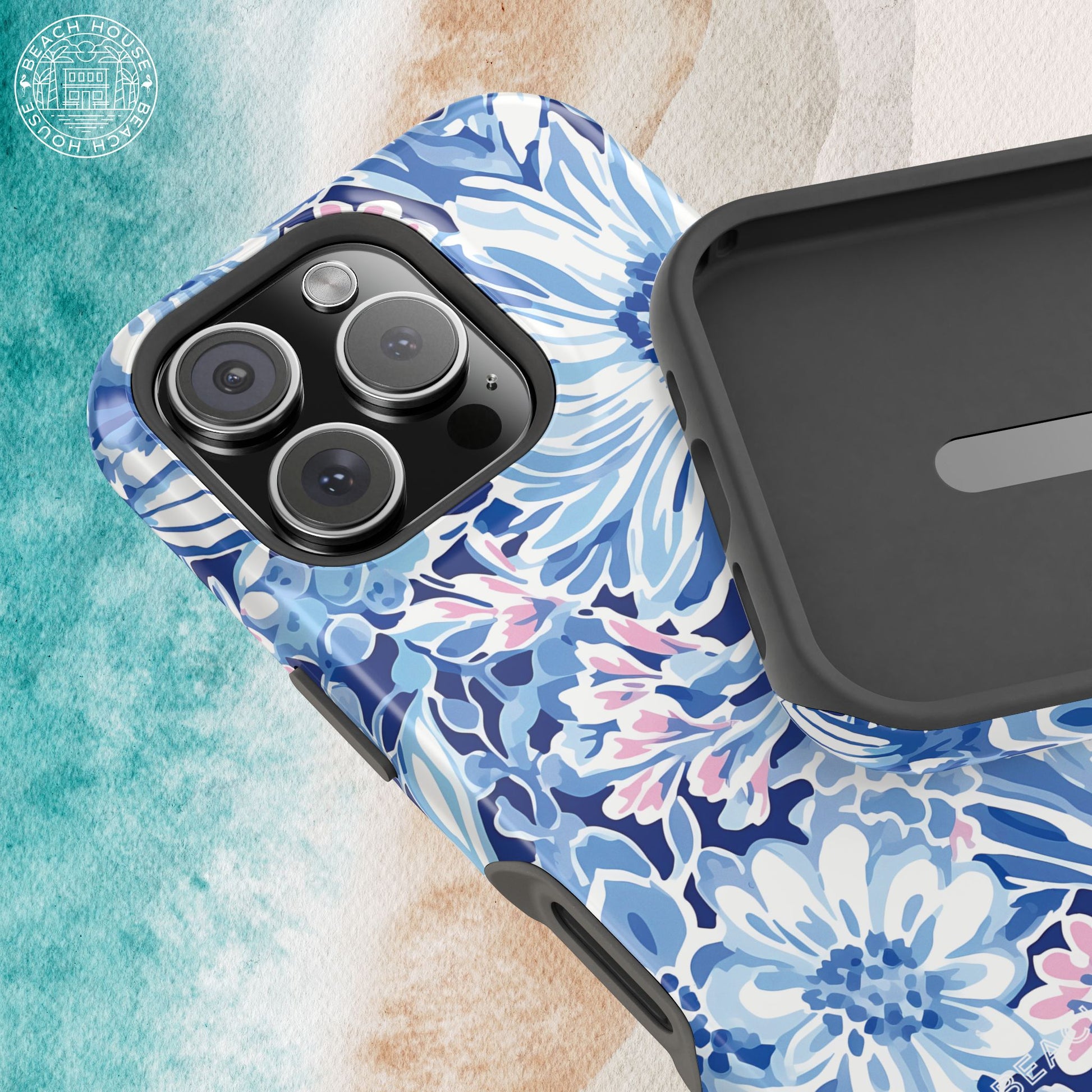 Phone case with blue floral pattern on a textured surface