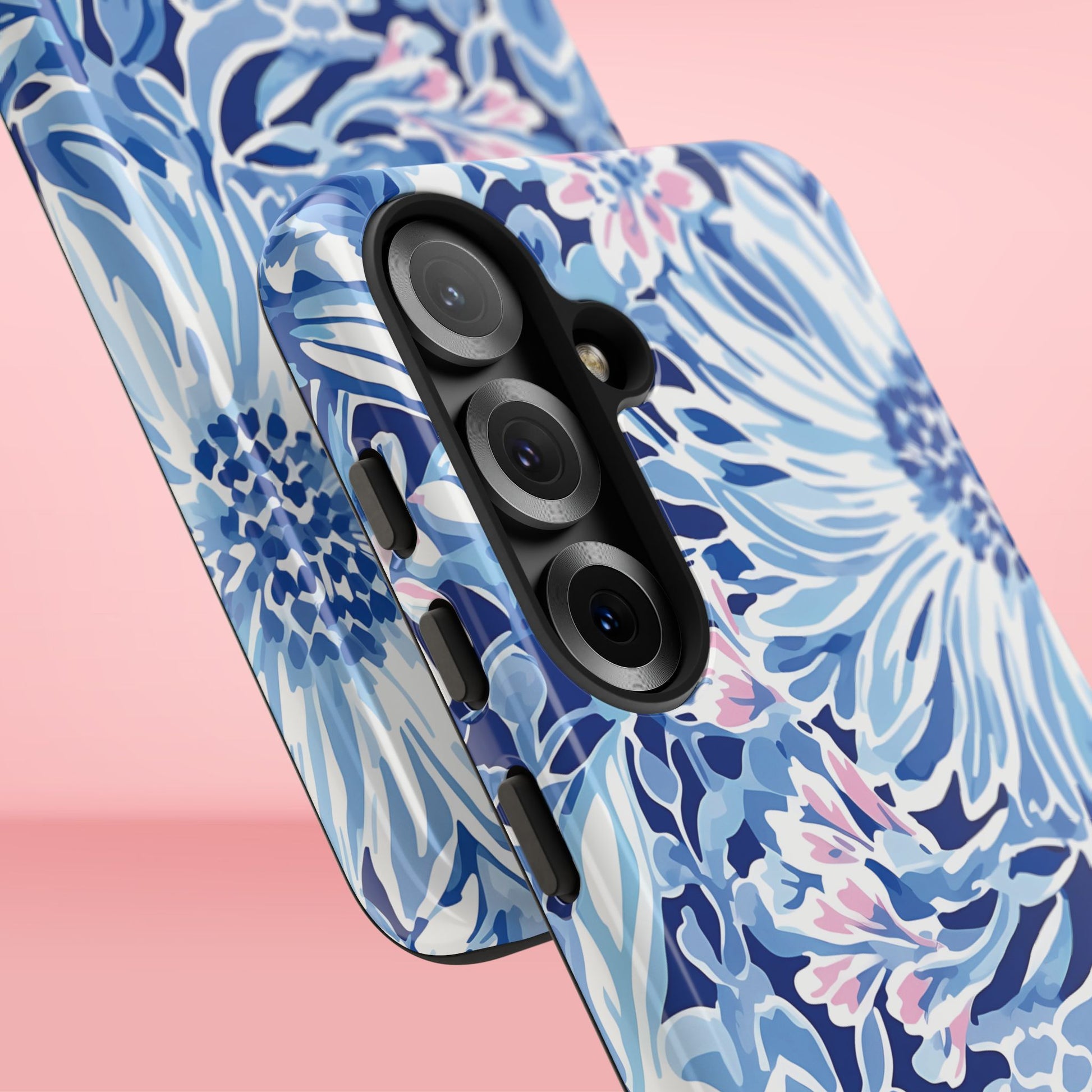 Close up views of the Huntington Tough Case for Galaxy with blue floral pattern on a pink background