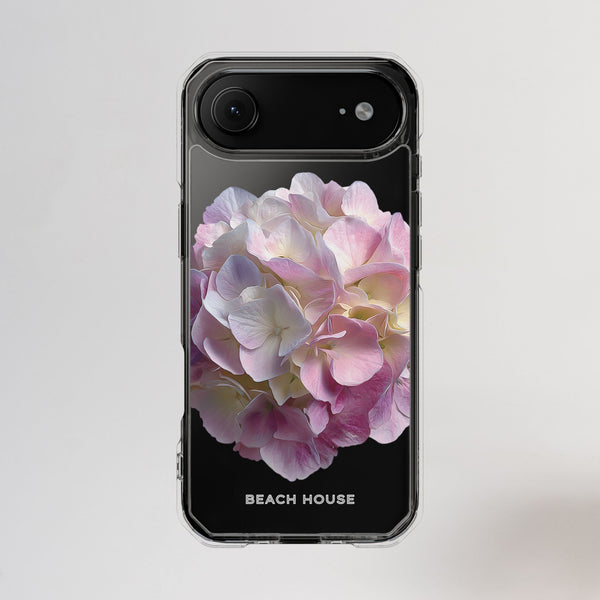 Phone case with pink flower design and 'Beach House' text on a light gray background