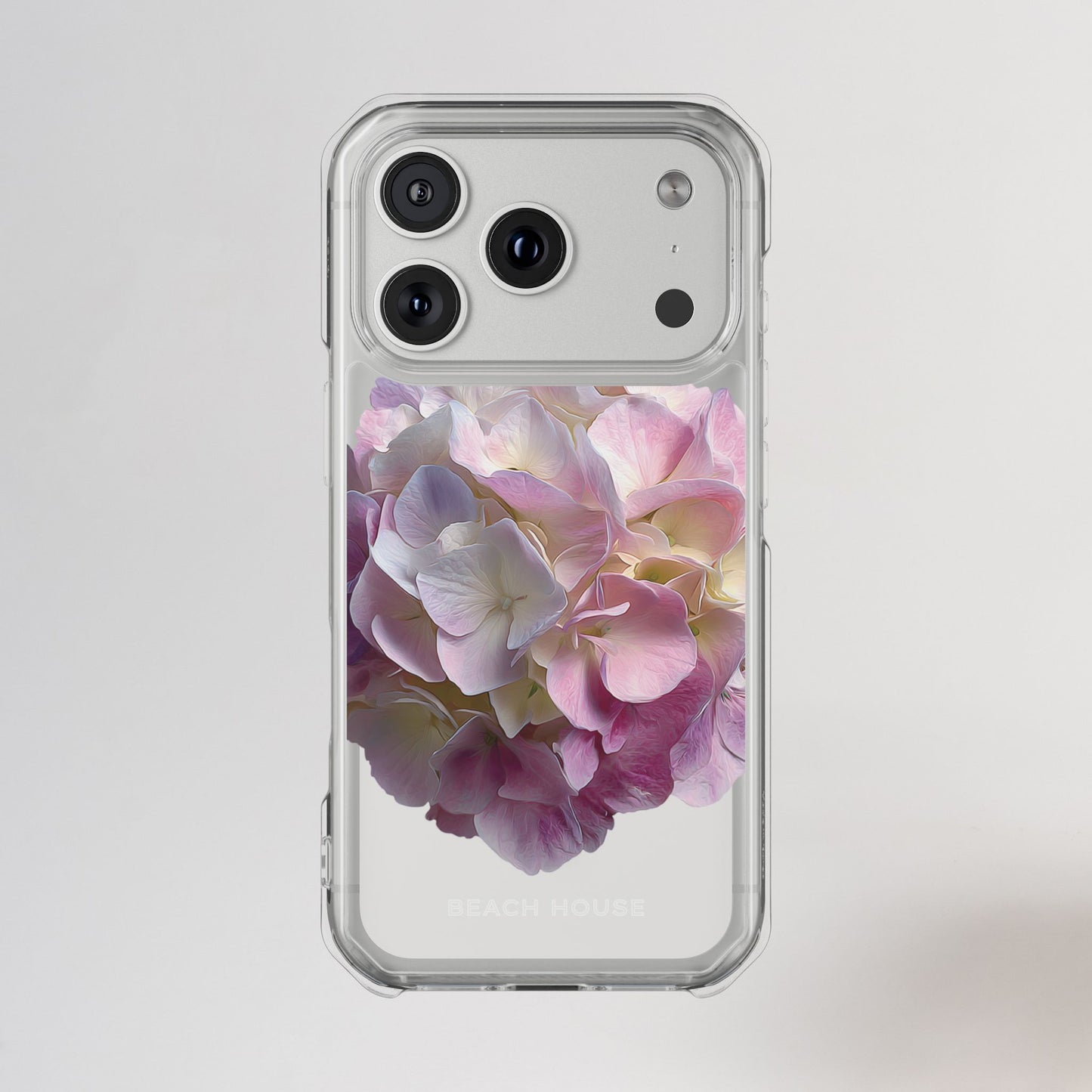 Phone case with pink and white floral design on a light gray background