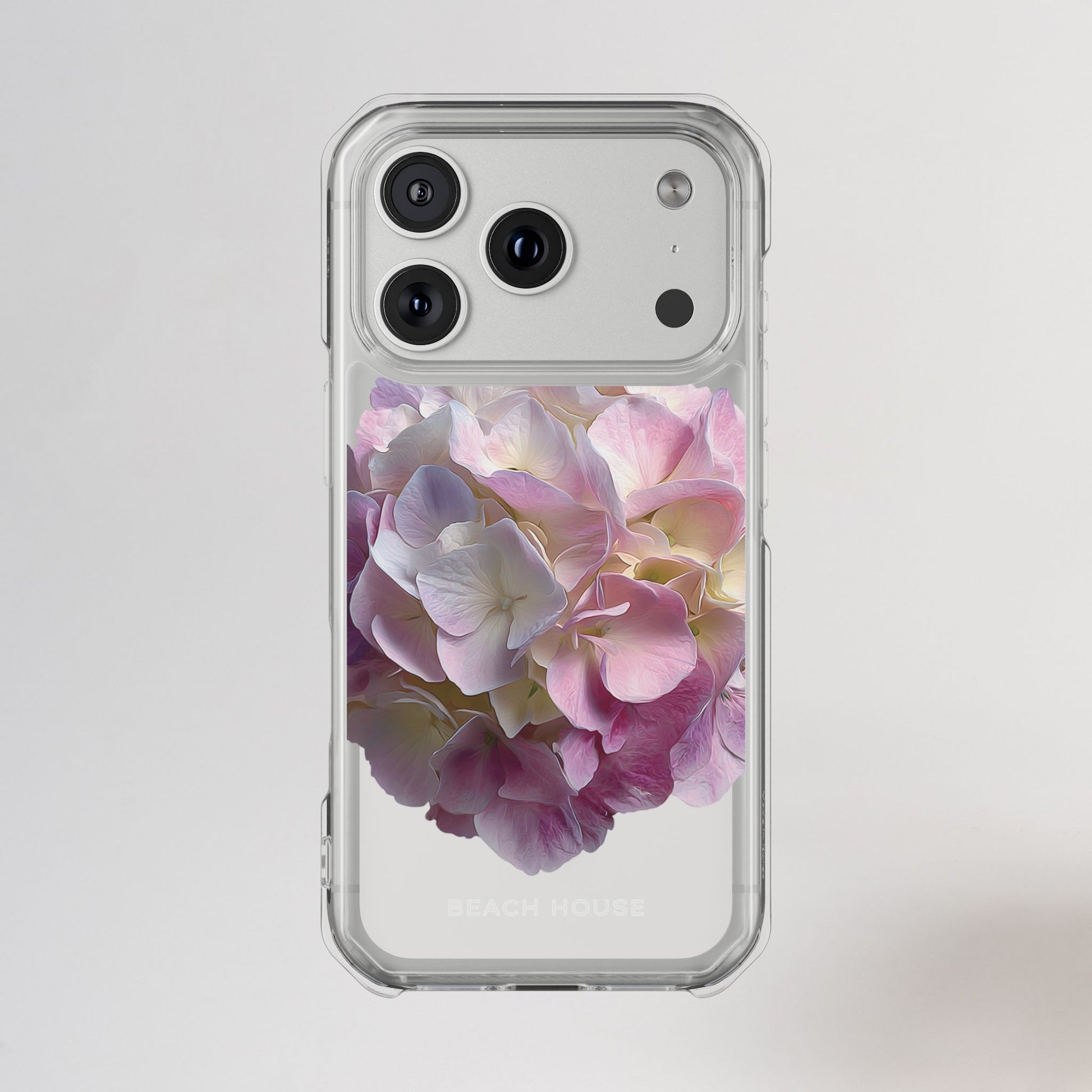 Phone case with pink and white floral design on a light gray background