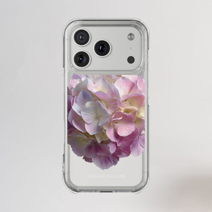 Phone case with pink and white floral design on a light gray background