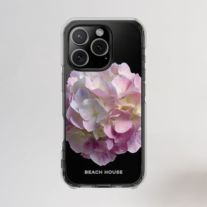 Phone case with pink floral design and 'Beach House' branding on a light gray background