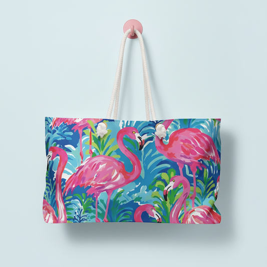 Key Largo Weekender tote bag with pink flamingo design on a light blue background
