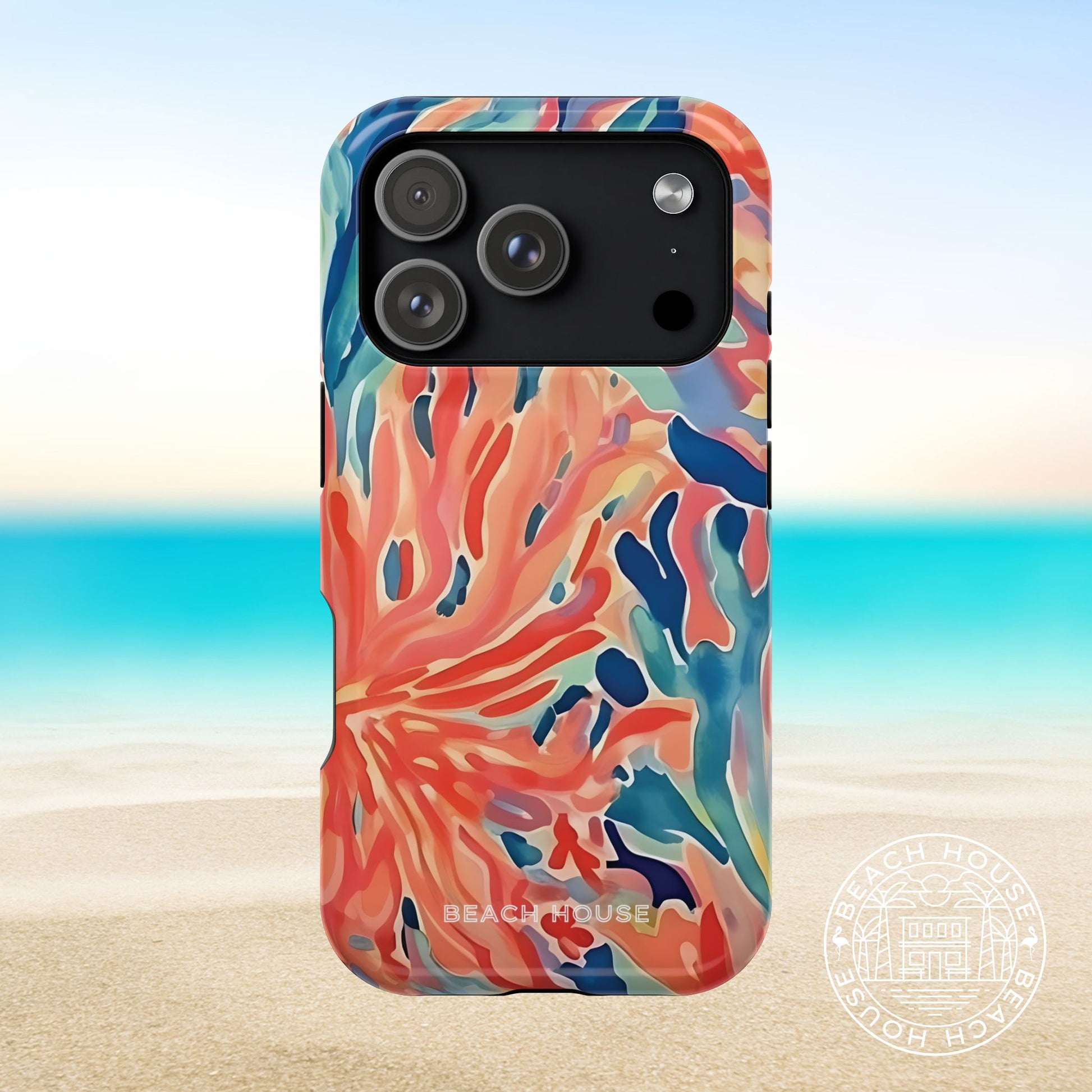 Key Biscayne MagSafe Tough Phone case with colorful coral design on a beach background