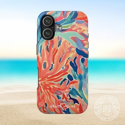 Colorful Key Biscayne Tough Case for iPhone 17 with a coral theme on a blurred beach background