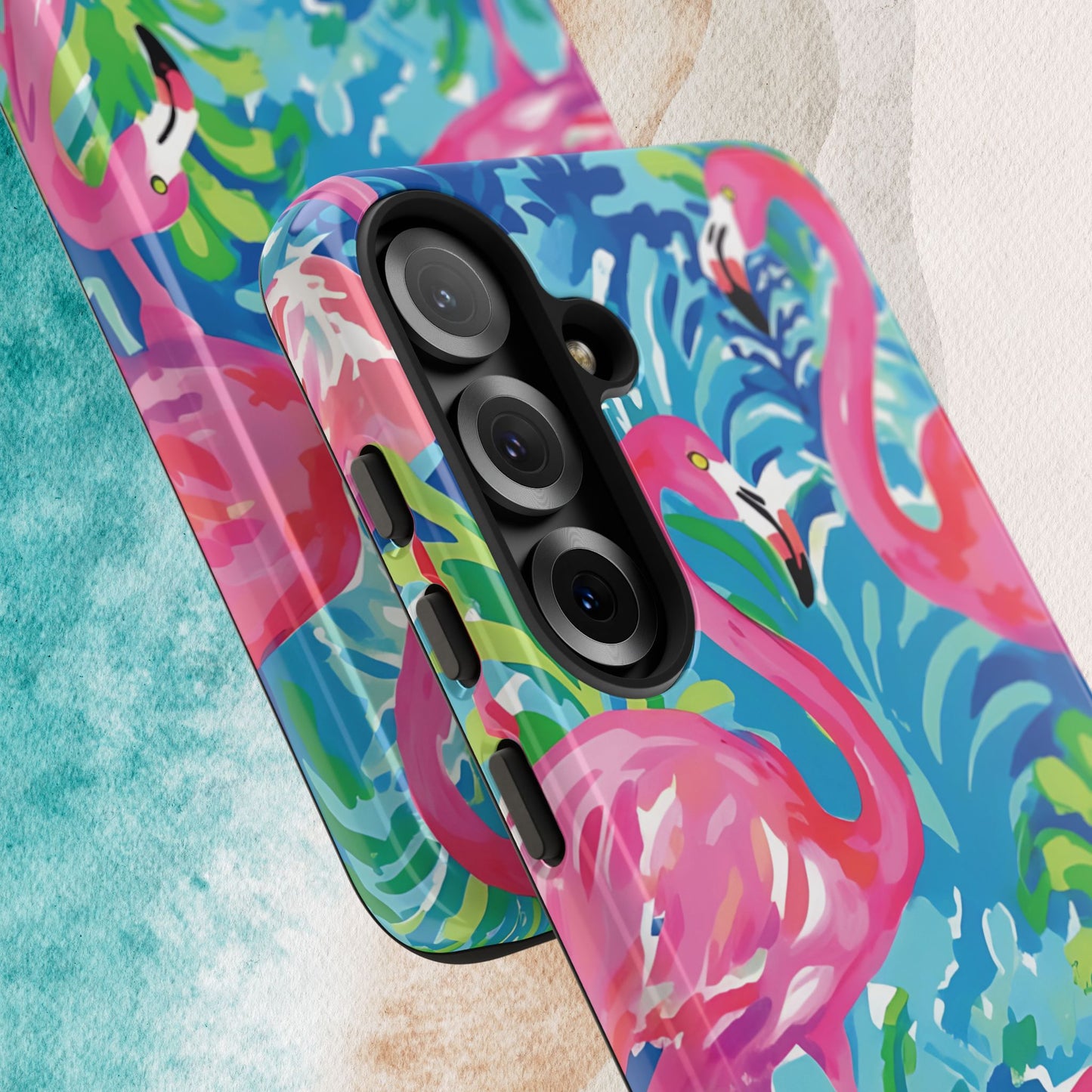 Close up views of Key Largo Tough Case for Galaxy with colorful flamingo design on a textured surface