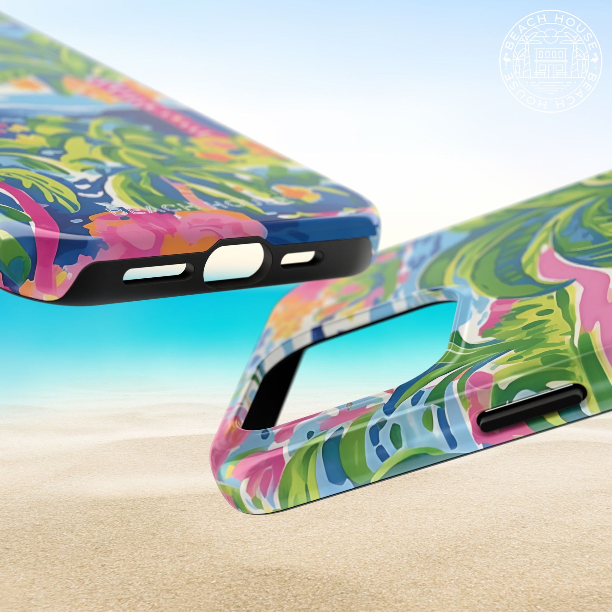 Top and bottom views of the Kiawah Tough Case for iPhone with a vibrant pattern on a beach background