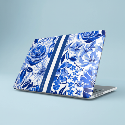 Laptop with blue floral Lexington MacBook Case on a light blue background