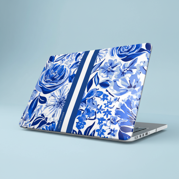 Laptop with blue floral Lexington MacBook Case on a light blue background