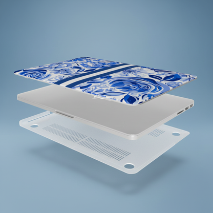 Laptop with a blue and white patterned Lexington MacBook Case on a gradient blue background