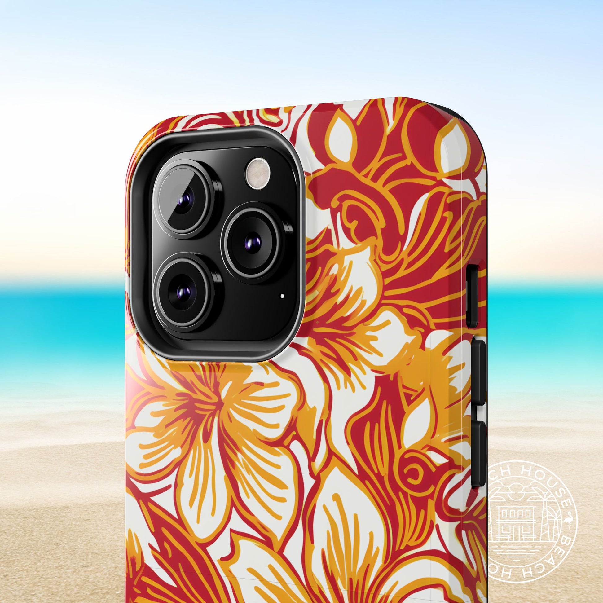 Close up view of the Los Angeles Tough Case for iPhone with floral design on a beach background