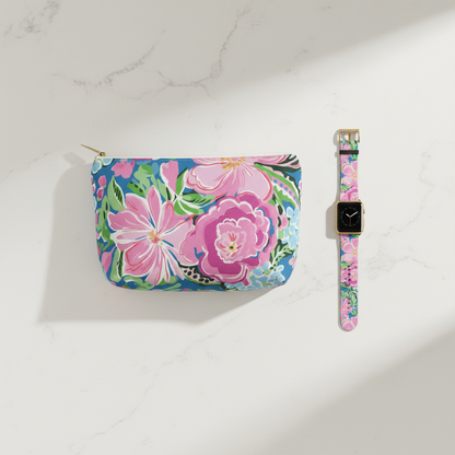 Floral-patterned pouch and watch band on a white marble background