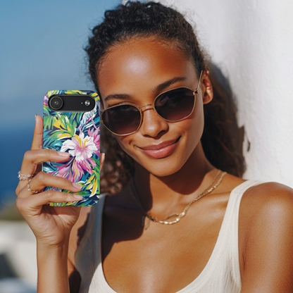 Woman holding a phone with a colorful floral case against a bright background
