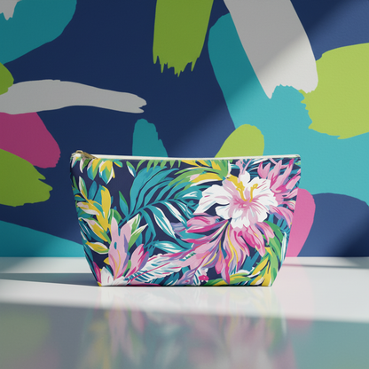 Floral-patterned pouch on a colorful abstract background