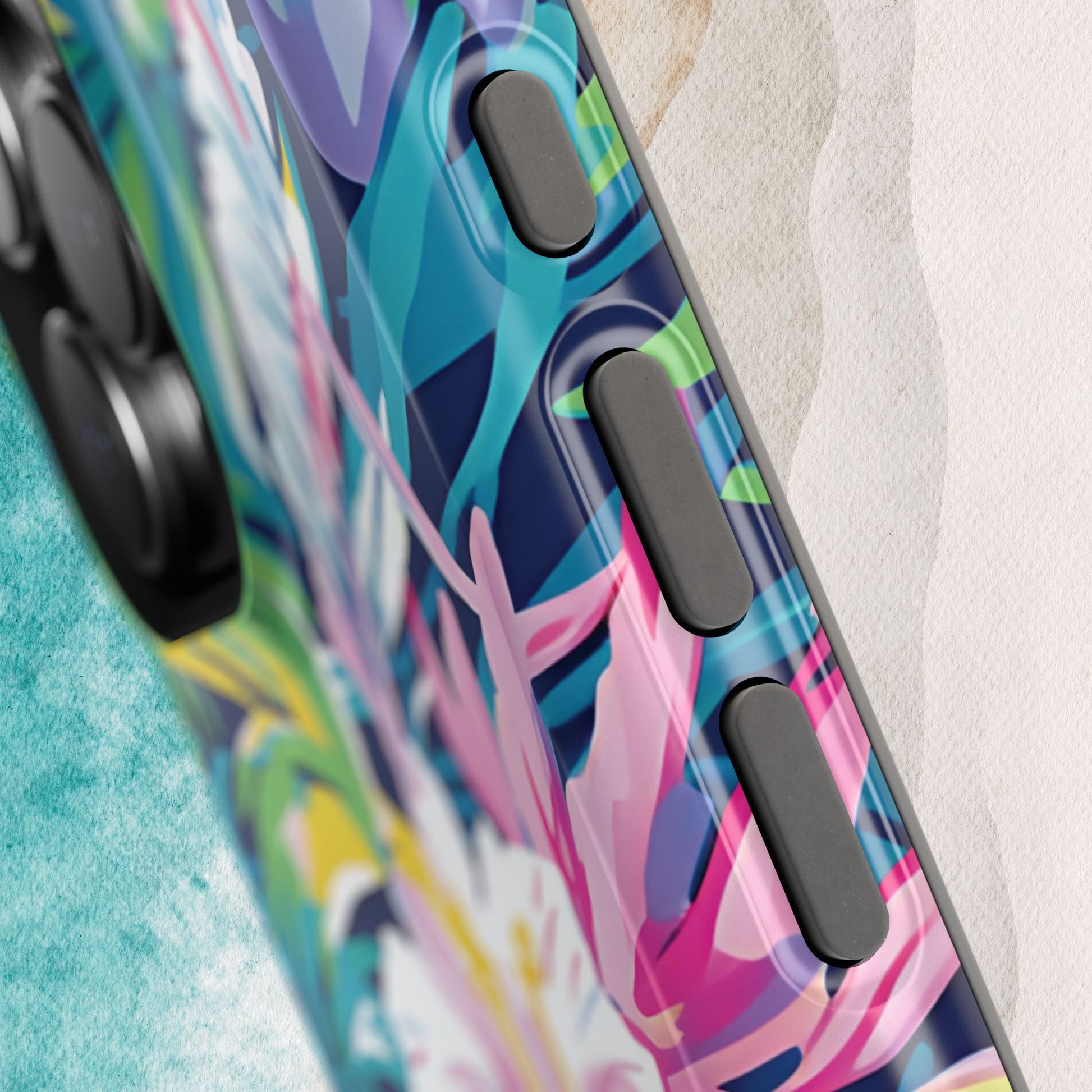 Close up view of Colorful Playa Hermosa MagSafe Tough phone case with abstract design on a textured surface