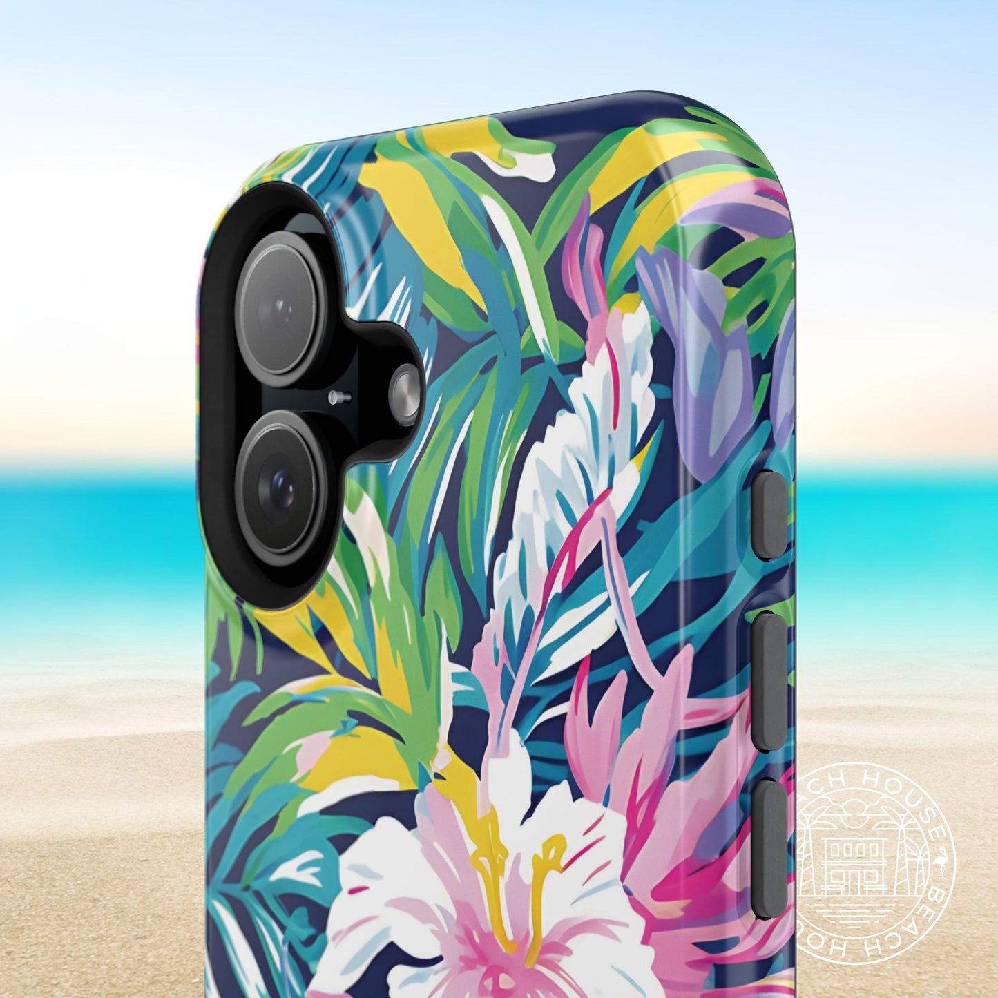 Phone case with colorful tropical leaf and flower design on a beach background