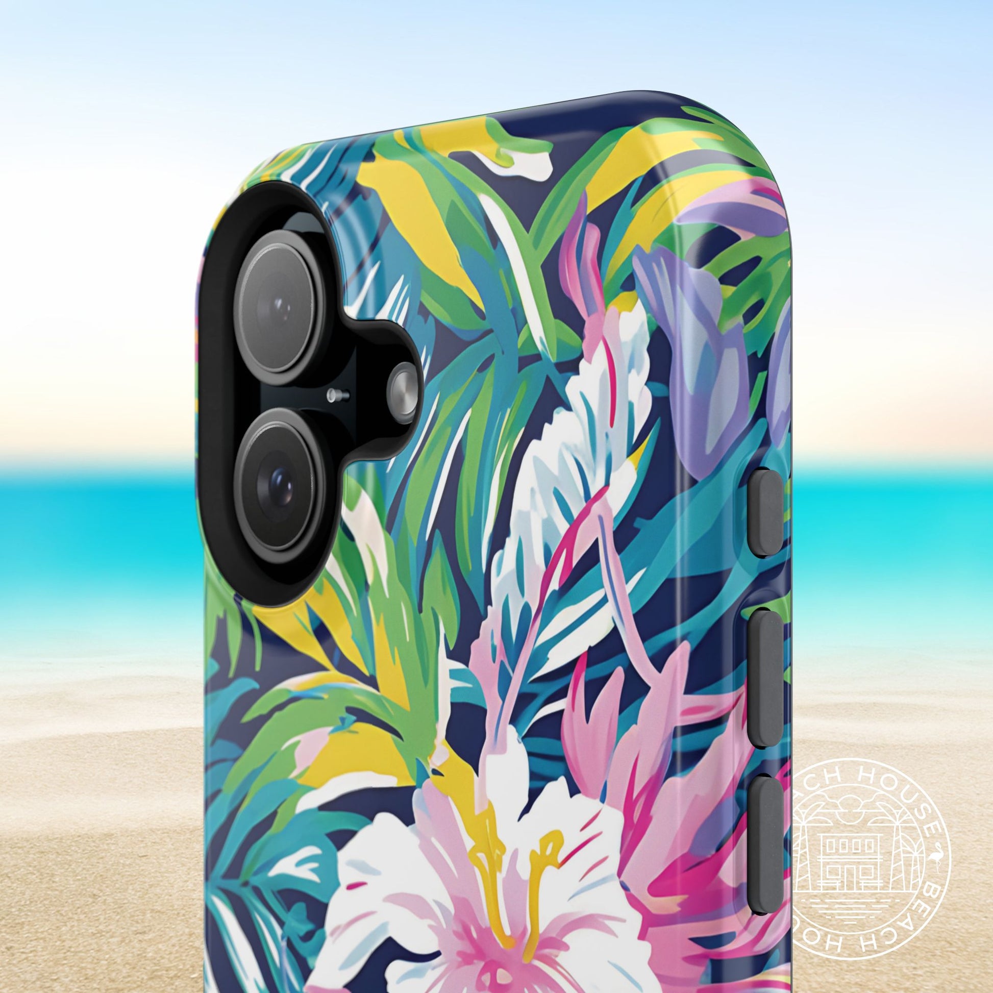 Phone case with colorful tropical leaf and flower design on a beach background