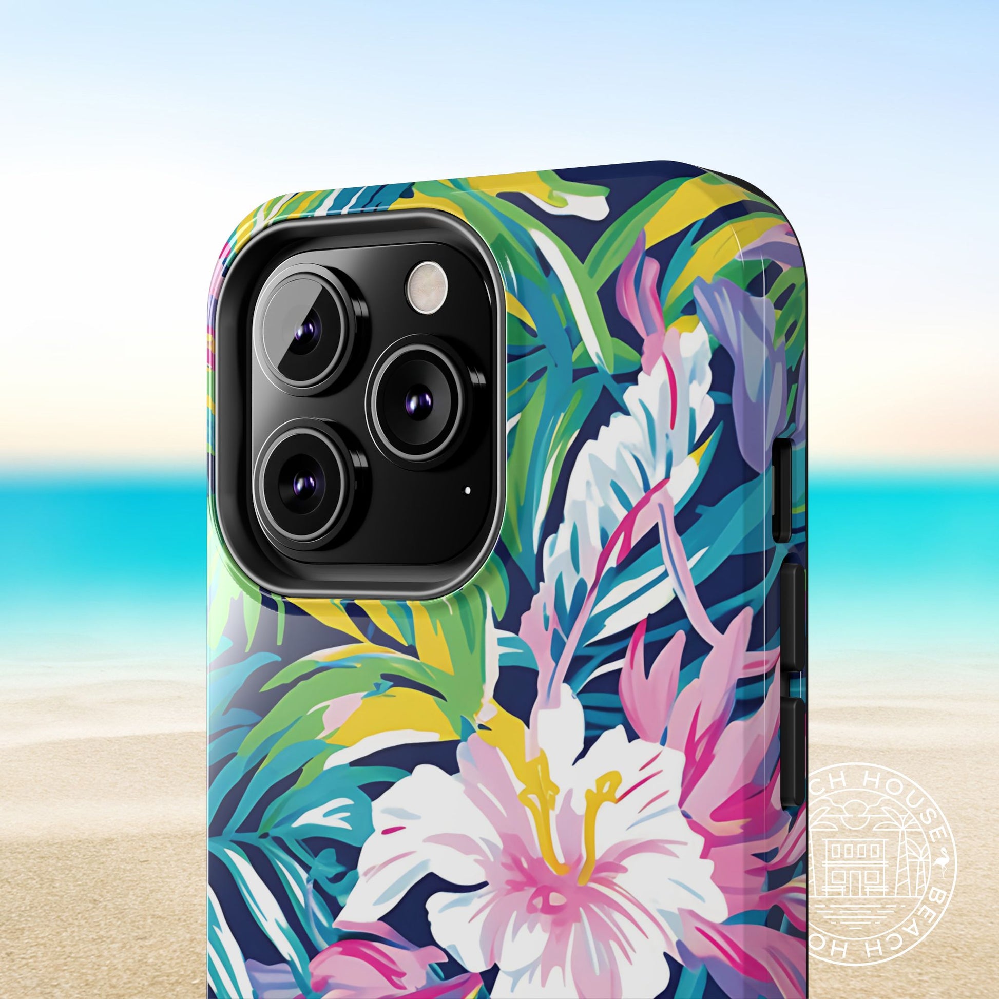 Close up view of the Playa Hermosa Tough Case for iPhone with tropical floral design on a beach background
