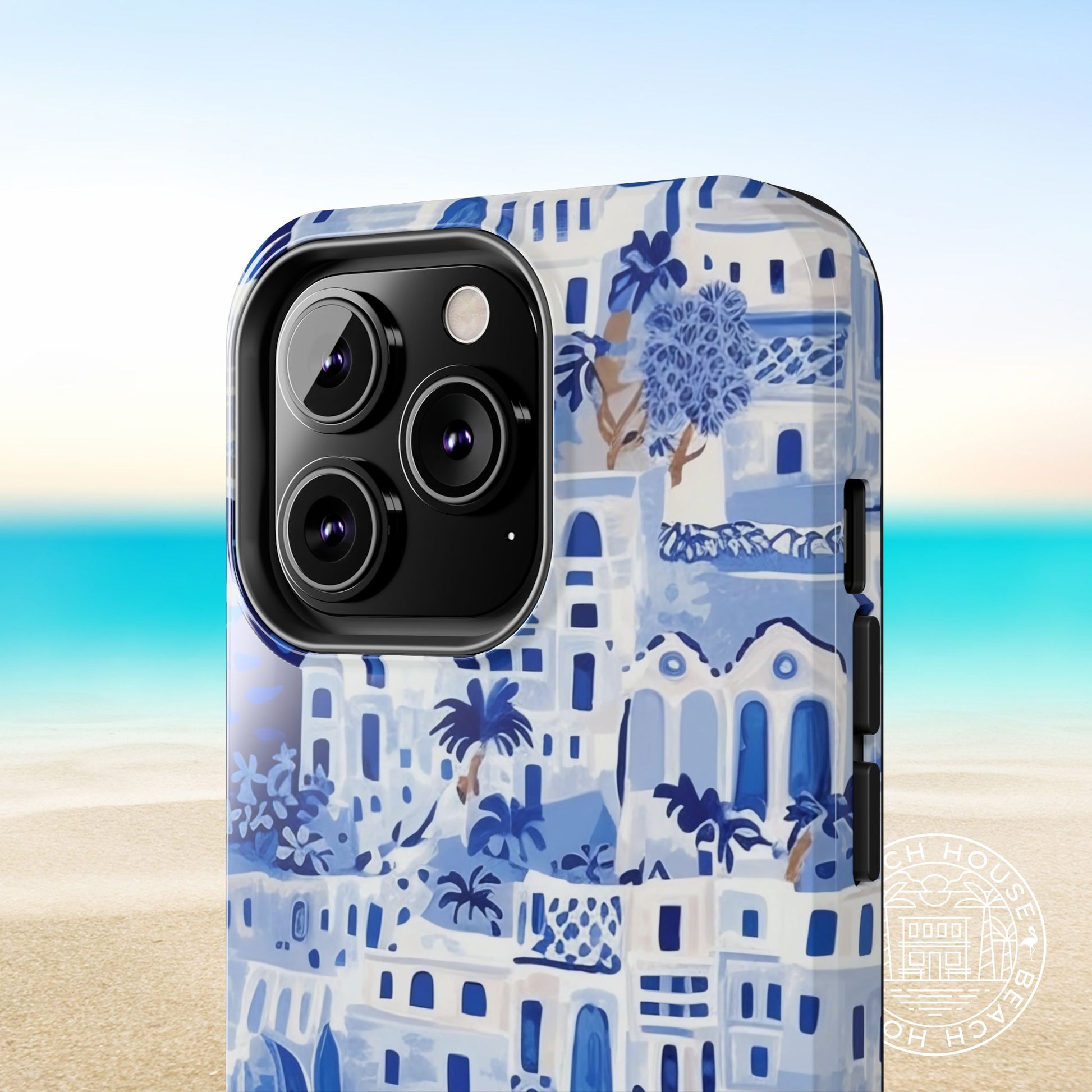 Phone case with blue Santorini pattern on a beach background