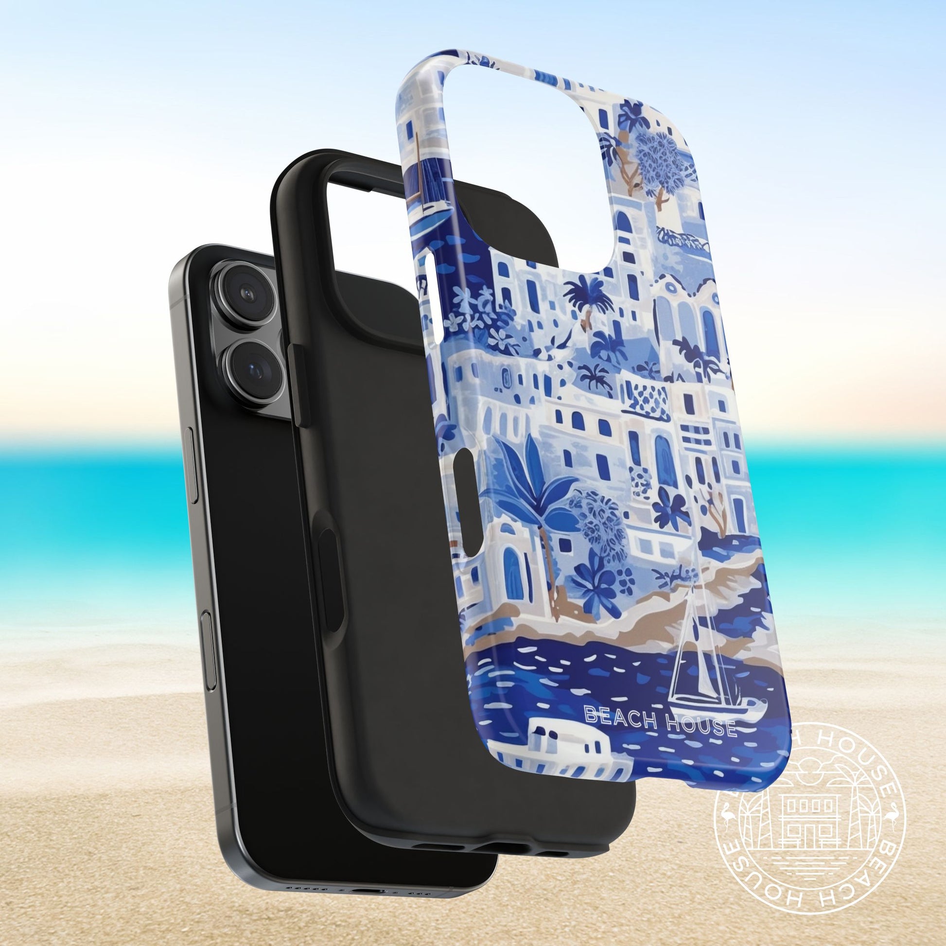 Protective Shell and shock absorbent liner layers of the Santorini Tough Case for iPhone next to a phone on a beach background
