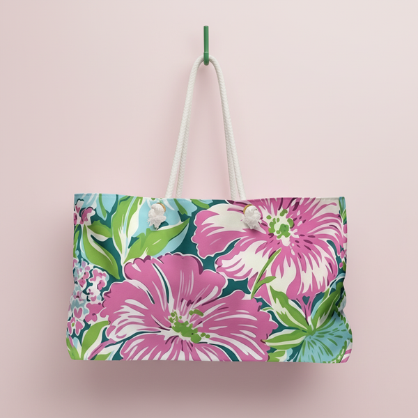 Floral patterned Seaside Weekender Tote Bag on a pink background