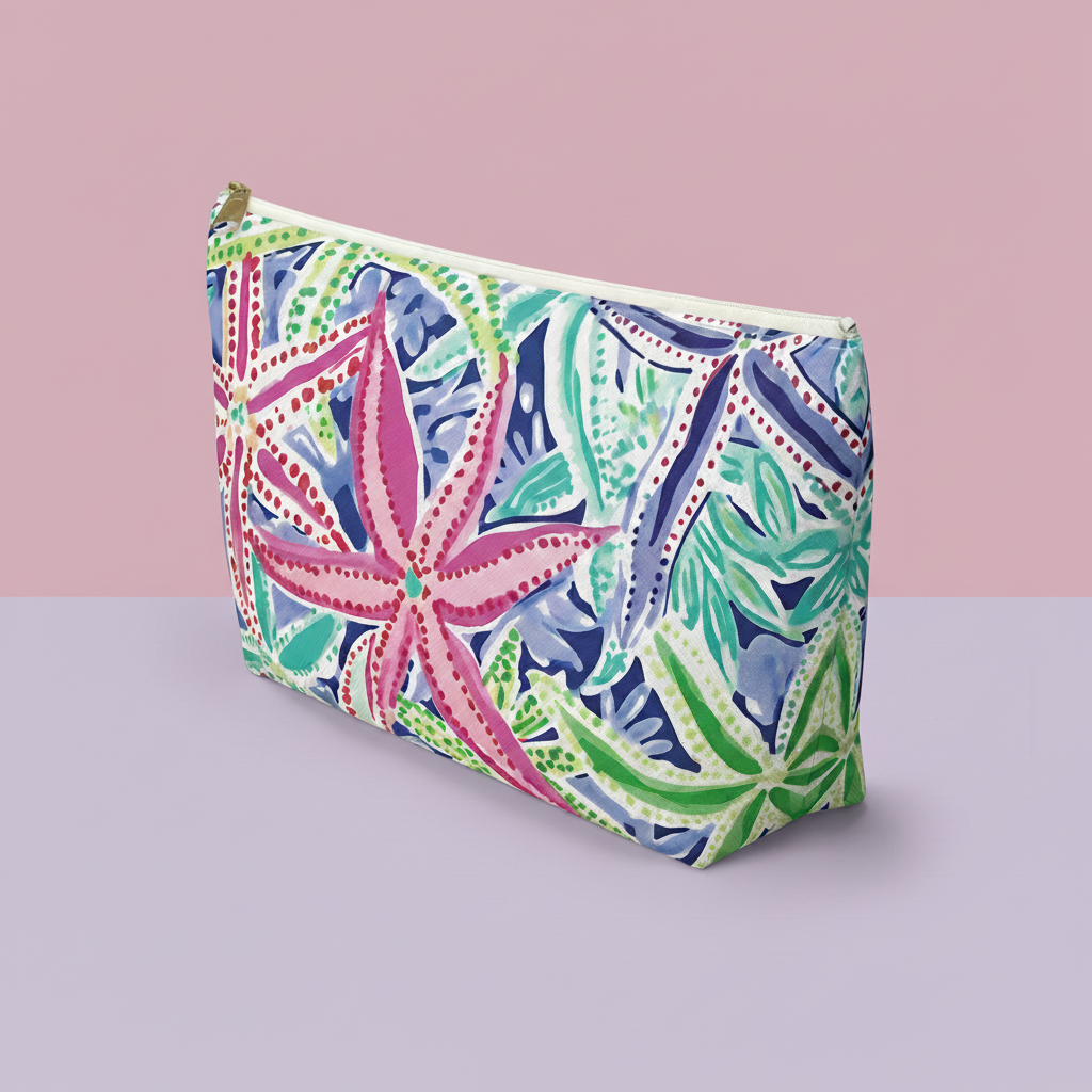 Colorful patterned pouch on a pink and gray background