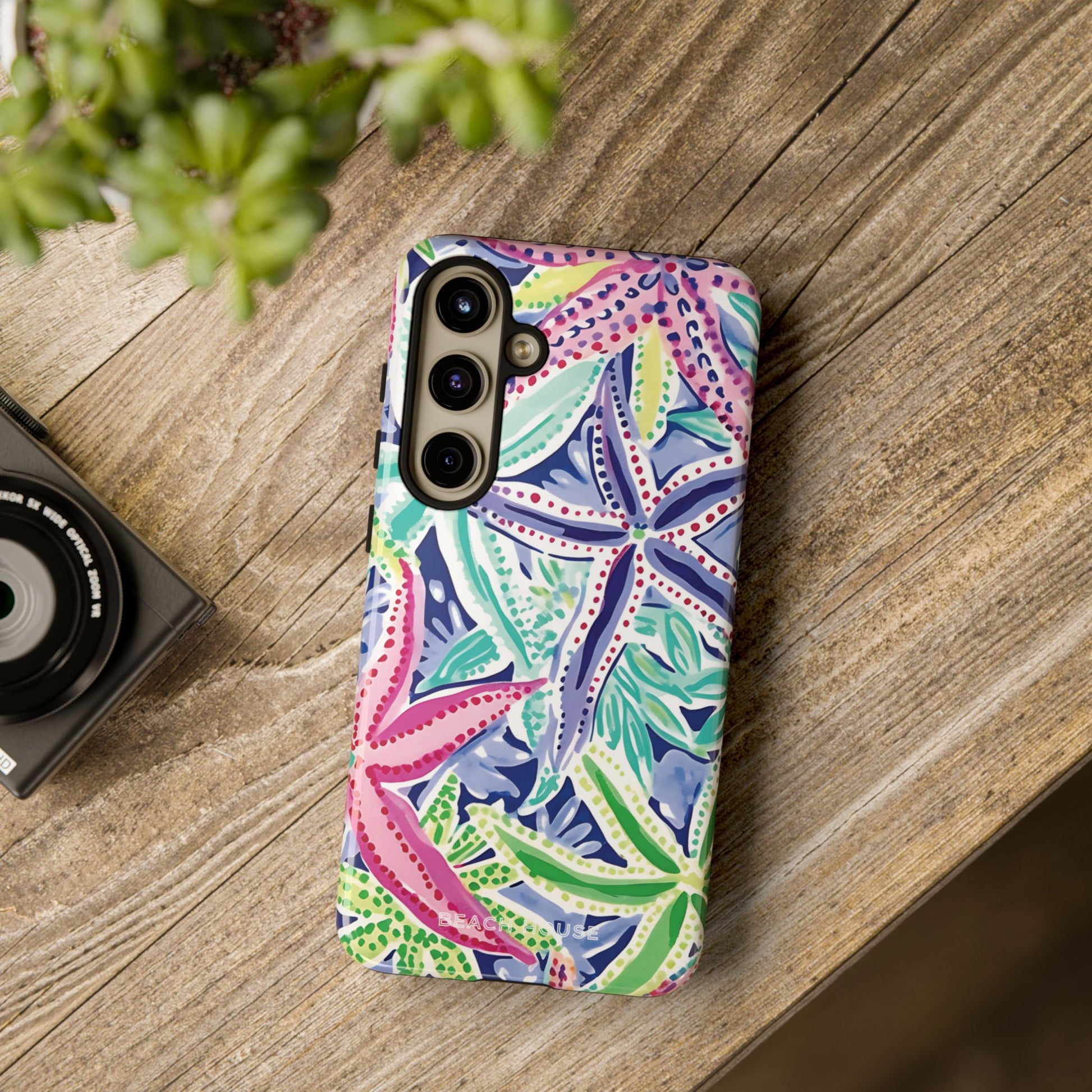 Siesta Key Tough Case for Galaxy with starfish pattern on a wooden surface
