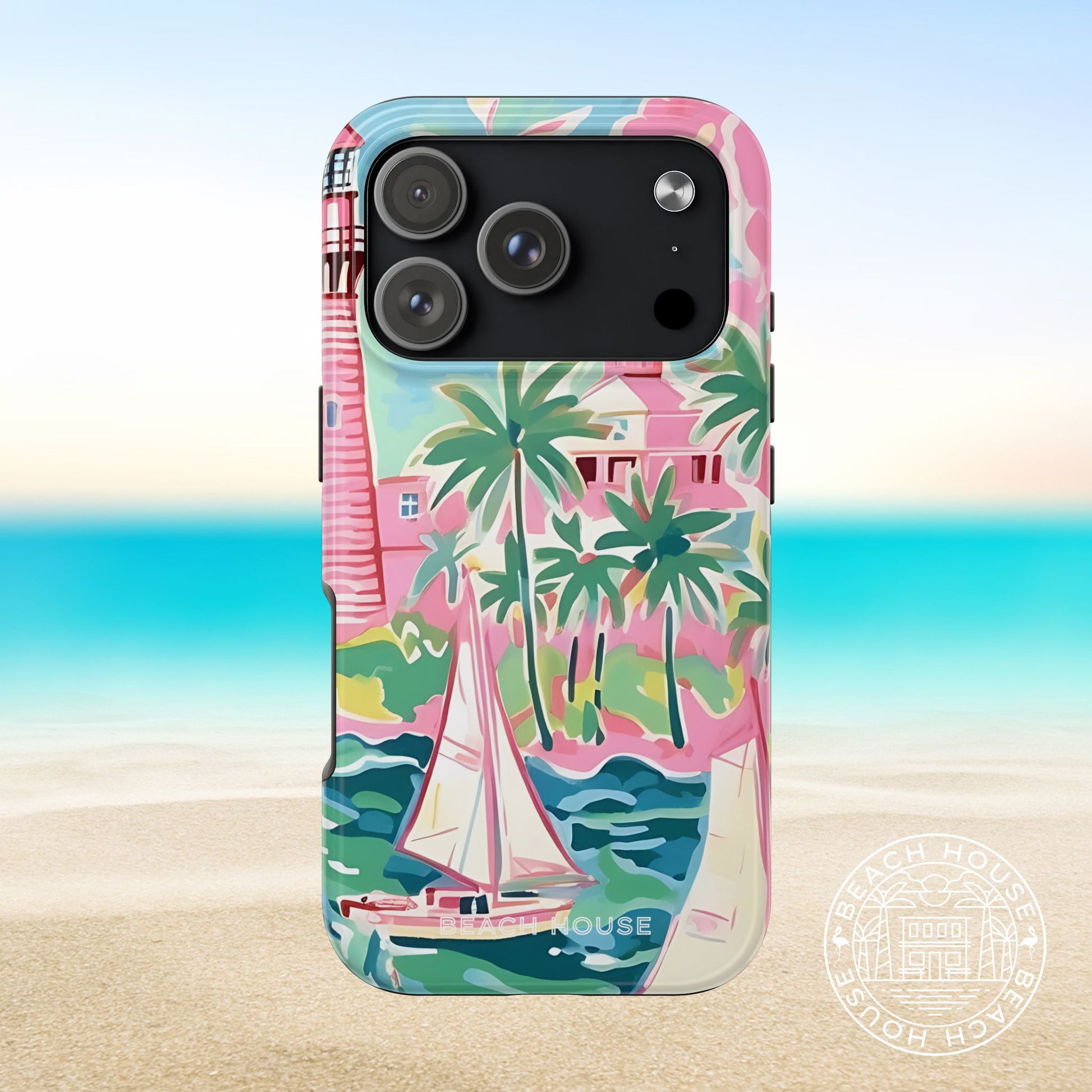 St. Simon Tough Case for iPhone 17 Pro with tropical design featuring palm trees and a sailboat, set against a beach background.