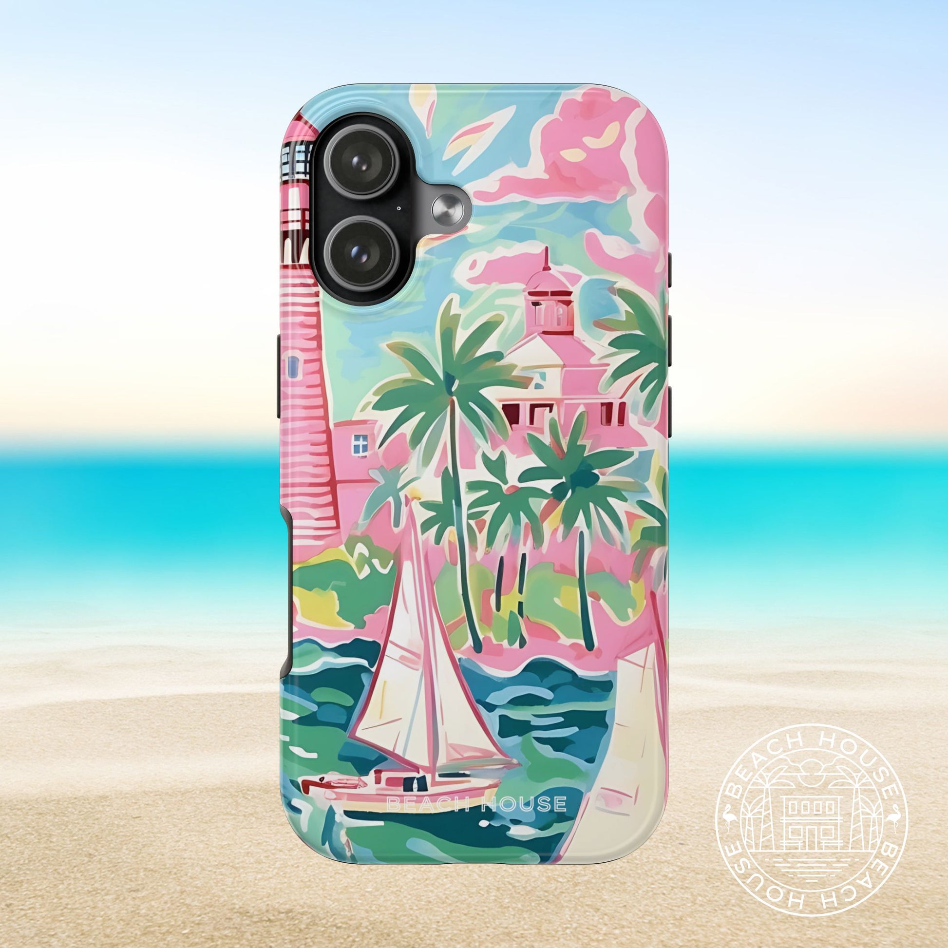 St. Simon Tough Case for iPhone 17 with a tropical design featuring a lighthouse, palm trees, and sailboat on a beach background.