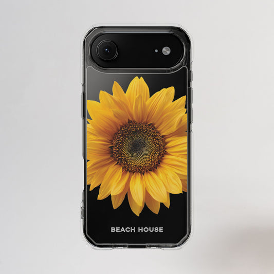 Phone case with a sunflower design and 'Beach House' text on a light gray background